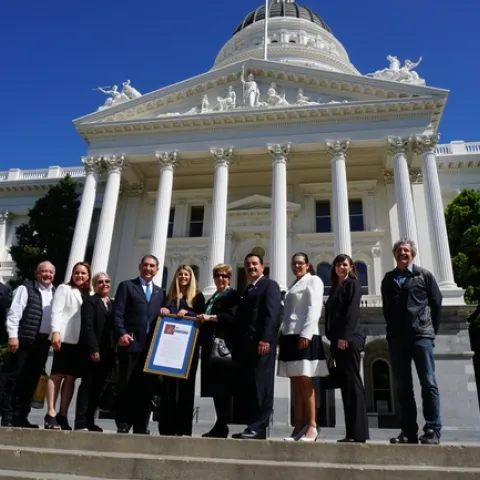 Mexican dignitaries and UC ANR 4-H leadership pose on the steps of the State Capitol after they accepted a resolution from the California State Senate recognizing their agreement to bring 4-H to Baja California.