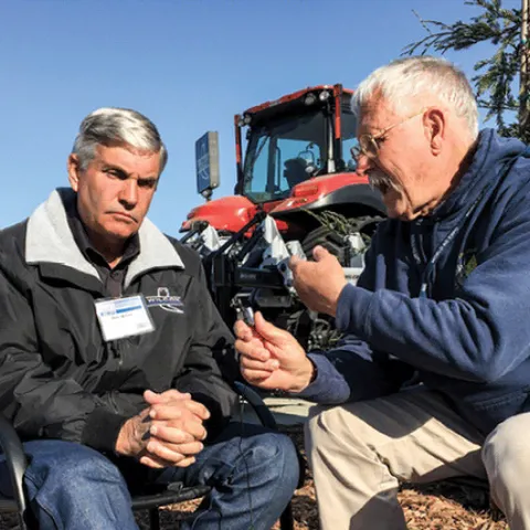 Alan Wilcox, left, and Jeff Mitchell debate the challenges and opportunities for conservation tillage. (Photo by Farm Equipment magazine, used with permission)