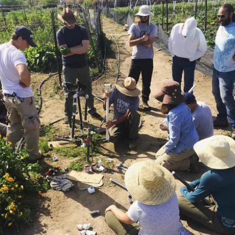 Students at Wild Willow Farm participate in a hands-on plumbing lesson.