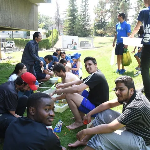 First the Hammock lab fills water balloons in an assemblyline procedure. (Photo by Kathy Keatley Garvey)