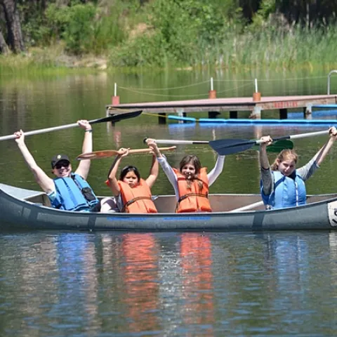 Stephanie, a teacher from Mills Middle School in Rancho Cordova, and happy paddlers are all smiles. Though learning is paramount at 4-H On the Wild Side, fun is never compromised. (Photo: Marianne Bird)