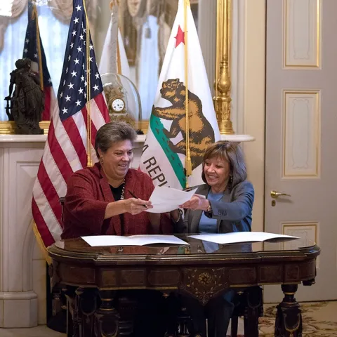 Glenda Humiston, left, and CDFA Secretary Karen Ross form ANR-CDFA partnership to help farmers adopt climate-smart agricultural practices. Photo by Evett Kilmartin