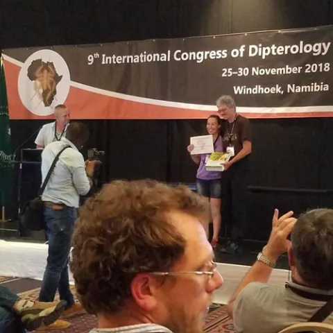 Professor Thomas Pape of the Natural History Museum of Denmark and chair of the Council for the International Congresses of Dipterology, presents the top student prize to Jessica Gillung. The next Congress takes place in 2022 in California.
