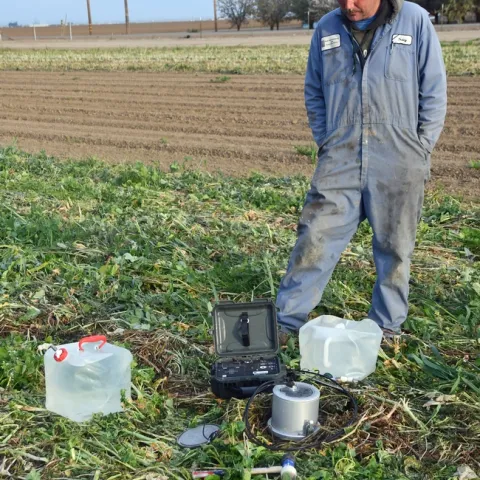 UC West Side REC agricultural technician Tracy Waltrip conducting soil hydraulic conductivity determination in the NRI Project field.