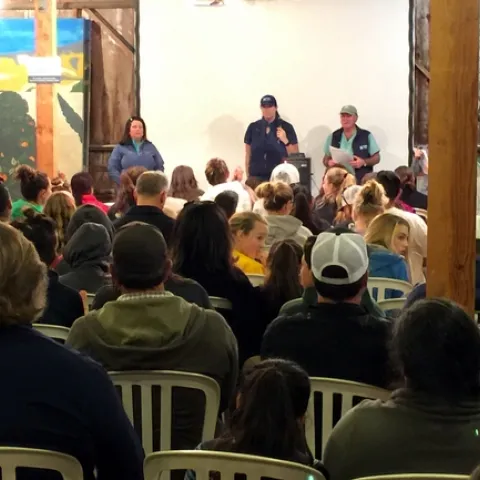 Dr. Mike's team speaks to the huge crowd