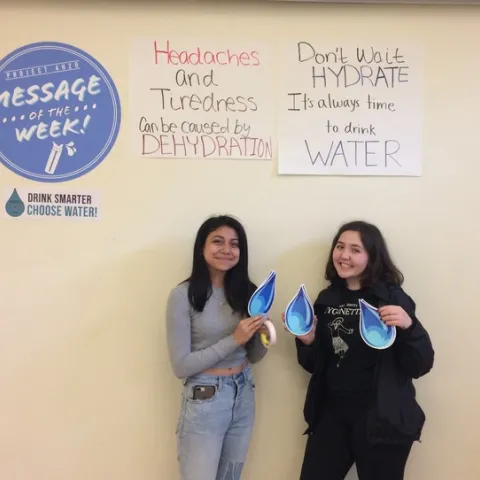 Project 4-H20 teens displaying the drinking water promotion message of the week