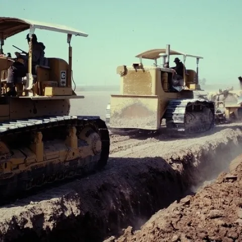 Figure 8. Tandem D8H crawlers pulling a large slip plow to thoroughly mix a stratified soil near Santa Maria. The result has been described as a "blended" terroir. Photo by Frank Laemmlen, retired Farm Advisor.