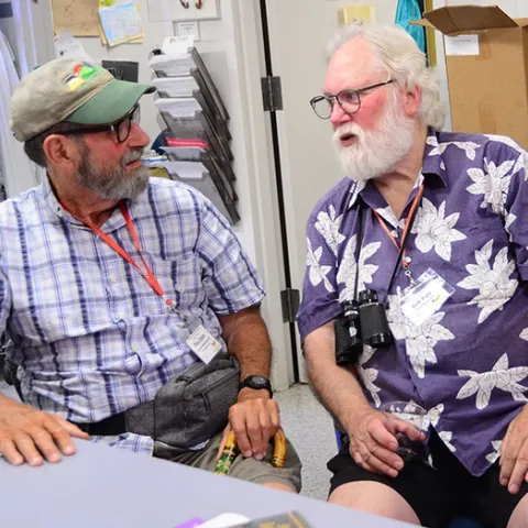 Legendary Lepidopterists Paul Opler (left), an octogenarian, and Robert Michael Pyle, a septuagenarian, chat during their visit to the Bohart Museum of Entomology. It was part of the Lepidopterists' Society's 68th annual conference. (Photo by Kathy Keatley Garvey)