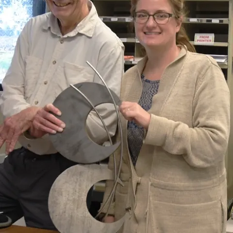 Bruce Hammock, founder and CEO of EicOsis and Cindy McReynolds, senior program manager, with the trophy. (Photo by Kathy Keatley Garvey)