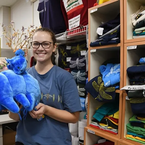 Entomologist Eliza Litsey, who received her bachelor's degree in entomology this year from UC Davis, shows some of the water bears (tardigrades) available in the Bohart Museum of Entomology gift shop. (Photo by Kathy Keatley Garvey)