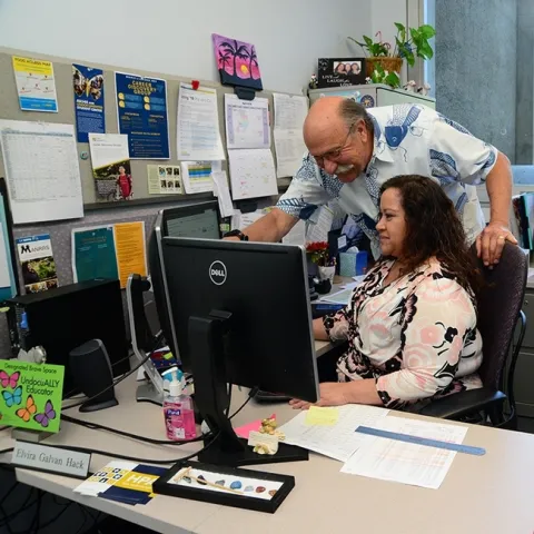 UC Davis animal biology major master advisor Robert Kimsey and advisor Elvira Galvan Hack confer on an advising plan. Both won regional advising awards from NACADA, the Global Community for Academic Advising.(Photo by Kathy Keatley Garvey)