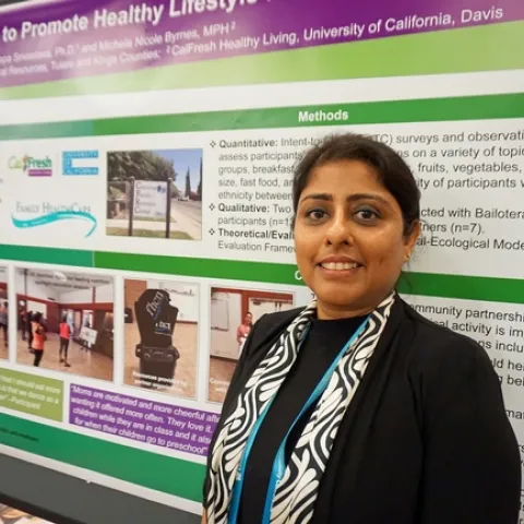 UCCE nutrition, family and consumer sciences advisor Deepa Srivastava in front of one of the posters she presented at the California Childhood Obesity Conference.