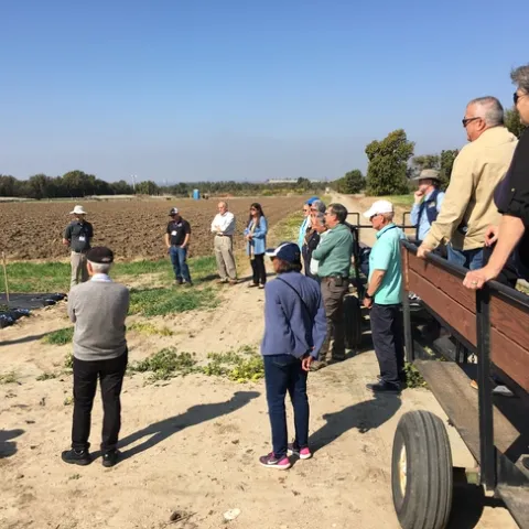 Alex and his graduate student talk about the importance of the RECs in conducting risky research. Photo courtesy of David Lewis.