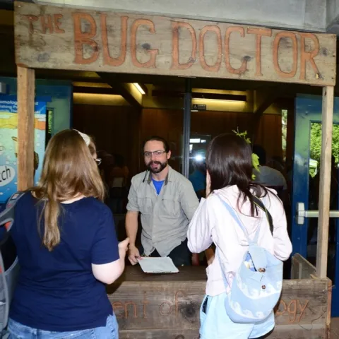 Brendon Boudinot, as a Bug Doctor at UC Davis Picnic Day, answers questions from visitors. (Photo by Kathy Keatley Garvey)