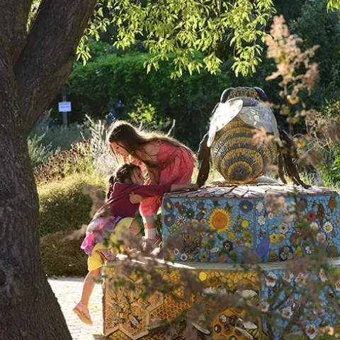 The Häagen-Dazs Honey Bee Haven's
"Miss Bee Haven" sculpture is the most photographed bee in the garden. Children love to touch it and climb it. (Photo by Kathy Keatley Garvey)