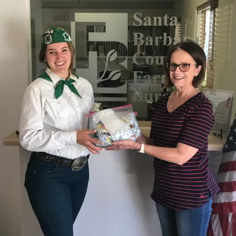 Olivia delivering 100 face masks to the Santa Barbara Farm Bureau.