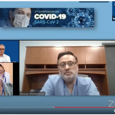 A screen shot of Riverside pulmonary specialist Anoop Maheshwari, relating his story about his near-death experience as a COVID-19 patient. In the background is organizer-moderator Walter Leal, UC Davis distinguished professor.