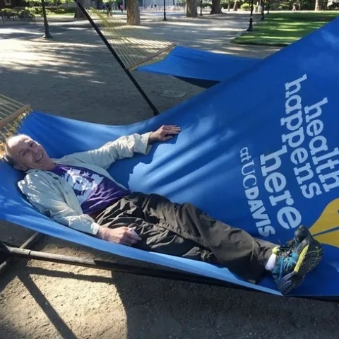 UC Davis distinguished professor Bruce Hammock "rests" in a hammock on the UC Davis campus. The occasion: the Hammock lab scientists were walking across campus (before the coronoavirus pandemic precautions). (Photo by Cindy McReynolds)
