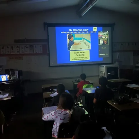 Photo of slideshow in classroom with students
