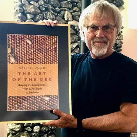 Eminent honey bee geneticist and biologist Robert E. Page Jr. with his new book, "The Art of the Bee."