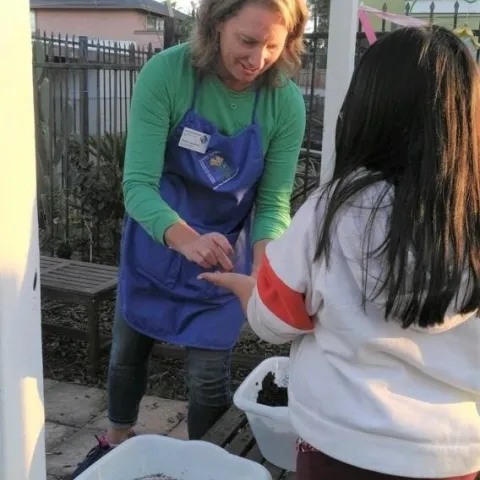 Brenda helping youth learn to garden at Micah House 3