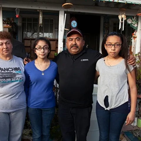 When Kristine Diekman spoke with the Garcia family, pictured in front of their home, they had been living without water in their well for almost two years. Photo by Kristine Diekman.