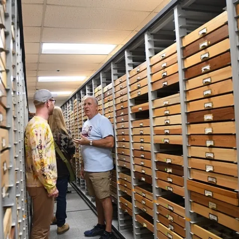 Entomologist Jeff Smith, curator of the Lepidoptera section at the Bohart Museum of Entomology, answers questions from UC Biodiversity Museum Day visitors. (Photo by Kathy Keatley Garvey)
