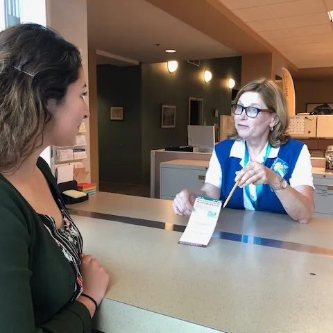 Master Gardener helping a client in 2019.