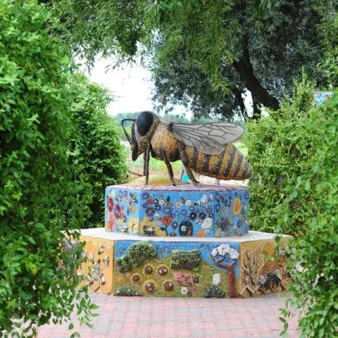 This sculpture of a worker bee anchors the UC Davis Department of Entomology and Nematology's Häagen-Dazs Honey Bee Haven. The worker bee sculpture, "Miss Bee Haven" is by Donna Billick of Davis. (Photo by Kathy Keatley Garvey)
