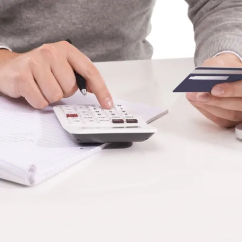 Hand punching numbers in calculator