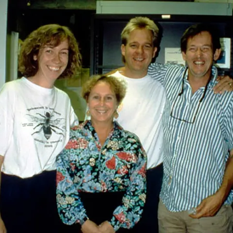 This image from 1993 at UC Davis shows Kelli Hoover (foreground), then a doctoral student. In back (from left) are doctoral students Bryony Bonning and Bill McCutcheon, and Professor Sean Duffey.
