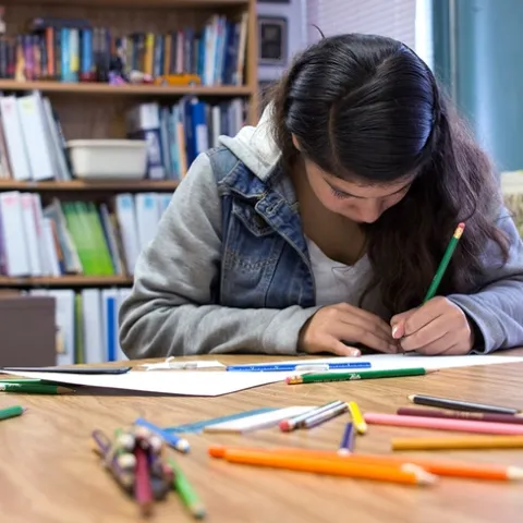 Young person working at a desk