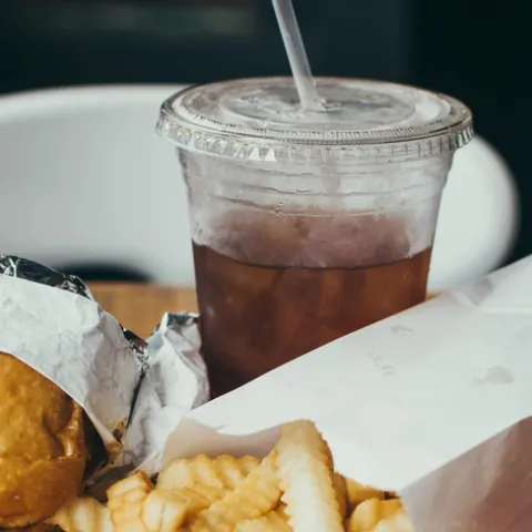 Soft drink with burger and fries