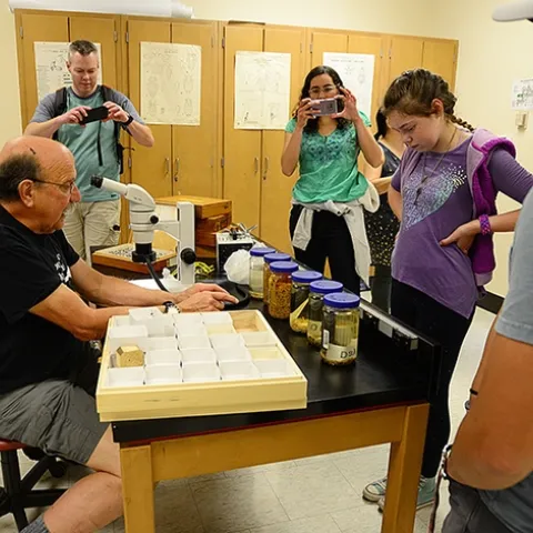 Visitors at the 2019 UC Davis Picnic Day take images of forensic entomologist Robert Kimsey of the UC Davis Department of Entomology and Nematology and his display. (Photo by Kathy Keatley Garvey)