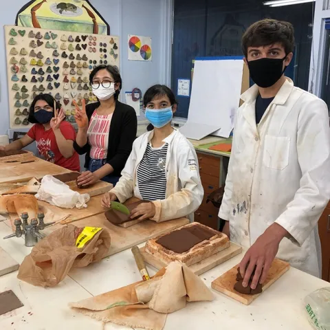 Working on clay molds are UC Davis students (from right to left) Ryan Meadows, Ashley Valdez, Heidi Tejeda Mata, and Imagine Morales.