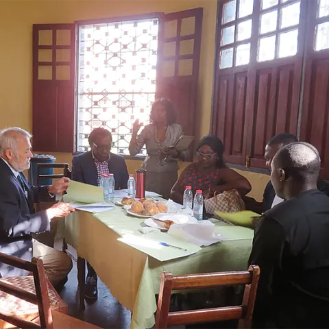 UC Davis distinguished professor James R. Carey (left foreground) brainstorms with other organizers of AgriStars. On his right is Prince Eyango.