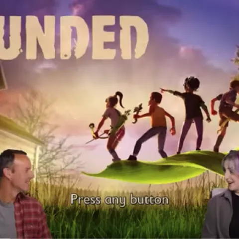 David Haviland and HelloIAmKate sit on stools with game graphics in background.