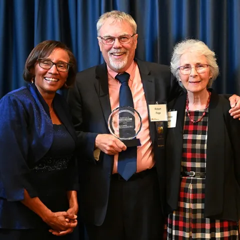 Honey bee geneticist Robert E. Page Jr. poses with his wife Michelle (right) and Helene Dillard, dean of the UC Davis College of Agricultural and Environmental Sciences at a 2022 ceremony honoring him as the recipient of the CA&ES Distinguished Emeritus Award. (Photo by Kathy Keatley Garvey)