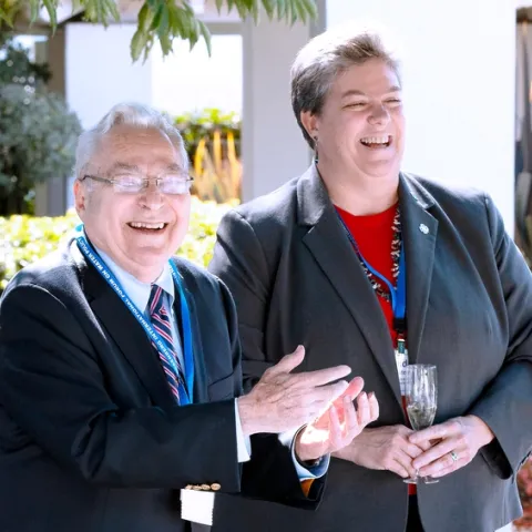 Rosenberg and Humiston share a laugh while standing outdoors.