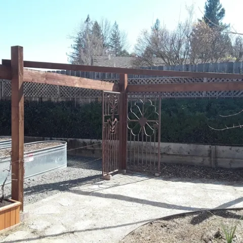 New permeable walkway, shade structure and garden bed in old turf grass area