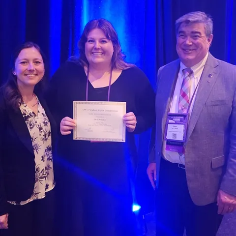 Congratulating Olivia Winokur (center), recipient of the Hollandsworth Prize for best student presentation at the American Mosquito Control Association (AMCA) annual conference are Casey Crockett (left), AMCA Student Competition coordinator, and Dennis Wallette, 2022-2023 AMCA president.