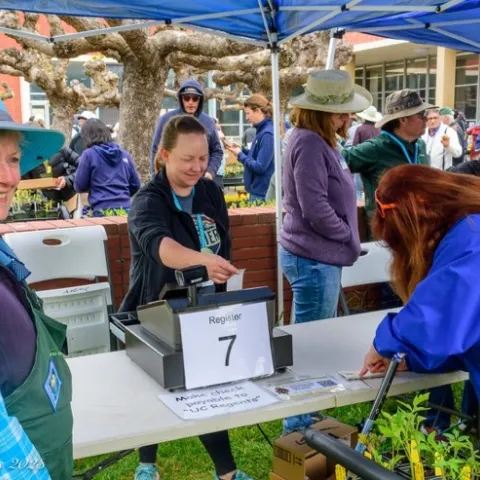 Mary Jo Corby, Erin Updegrove, Michelle Jones, Richard Schmidt and Mary Stewart at the register at the Richmond Library GTPS. Photo by Fletcher Oakes.