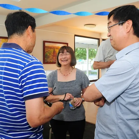 At her retirement party July 22, 2016 in the Stonegate Country Club, Davis, Shirley Gee chats with colleagues Hee Joo Kim (left), former Hammock lab post-doctorate and currently at Bayer US Innovation Center in Mission Bay, San Francisco; and Ki Chang Ahn, former Hammock lab post-doctorate and currently at PTRL West in Richmond, Calif. (Photo by Kathy Keatley Garvey)