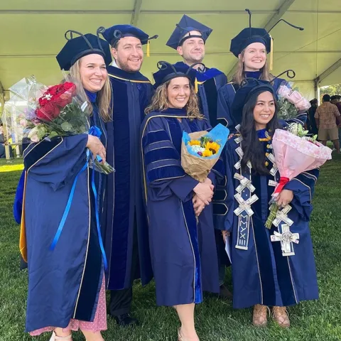 Entomology PhDs wore insect antennae on their mortarboards. In front (from left) are six new PhDs: Lindsay Mack and Erin "Taylor" Kelly of the Geoffrey Attardo lab; and Christine Tabuloc of the Joanna Chiu lab. In back are Xavier Zahnle of the Jason Bond lab; and Zachary Griebenow and Jill Oberski of the Phil Ward lab.