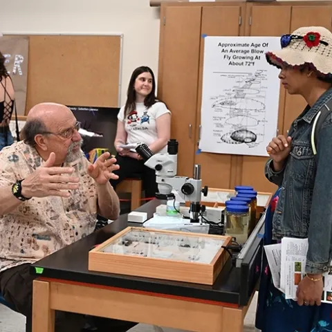 UC Davis forensic entomologist Robert "Bob" Kimsey answering questions at his "Dr. Death" booth in Briggs Hall during the 2023 UC Davis Picnic Day. (Photo by Kathy Keatley Garvey)