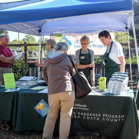 UC Master Gardeners answer questions at an AAMG booth. Photo by UC Master Gardener