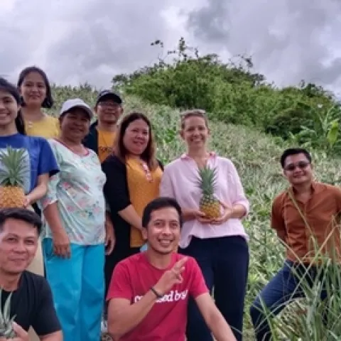 Agritourism Coordinator, Rachael Callahan, with AHSI staff and farmers, visiting a pineapple farm in Rizal.