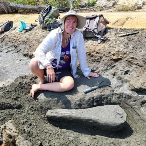 UC Davis alumna Emily Bzdyk with the 15-million-year-old dolphin skull fossil she found on the western shore of Chesapeake Bay, Calvert County, Maryland.