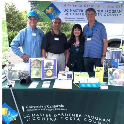 Photo by UC Master Gardener CoCoMGs Bob Archer, Sunil Deo, Terri Takusagawa and Greg Doyle at the San Ramon Farmers Market.