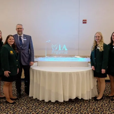 Brent Hales stands with 4-H youth